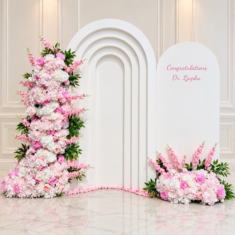 White layered arch panels with pink faux floral accents